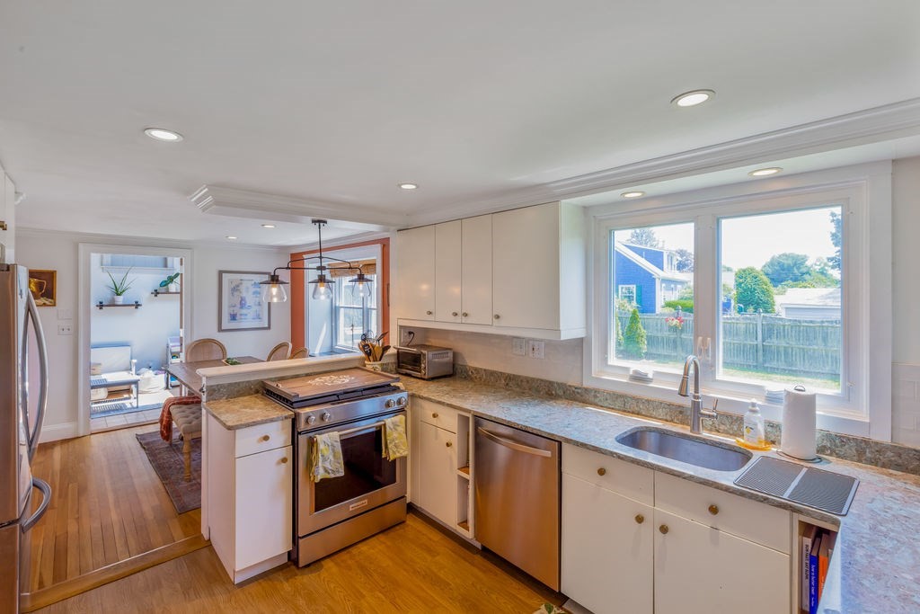 2 Princeton Avenue Beverly, MA 01915 - Photo 3 of 27 a kitchen that has a sink and a stove