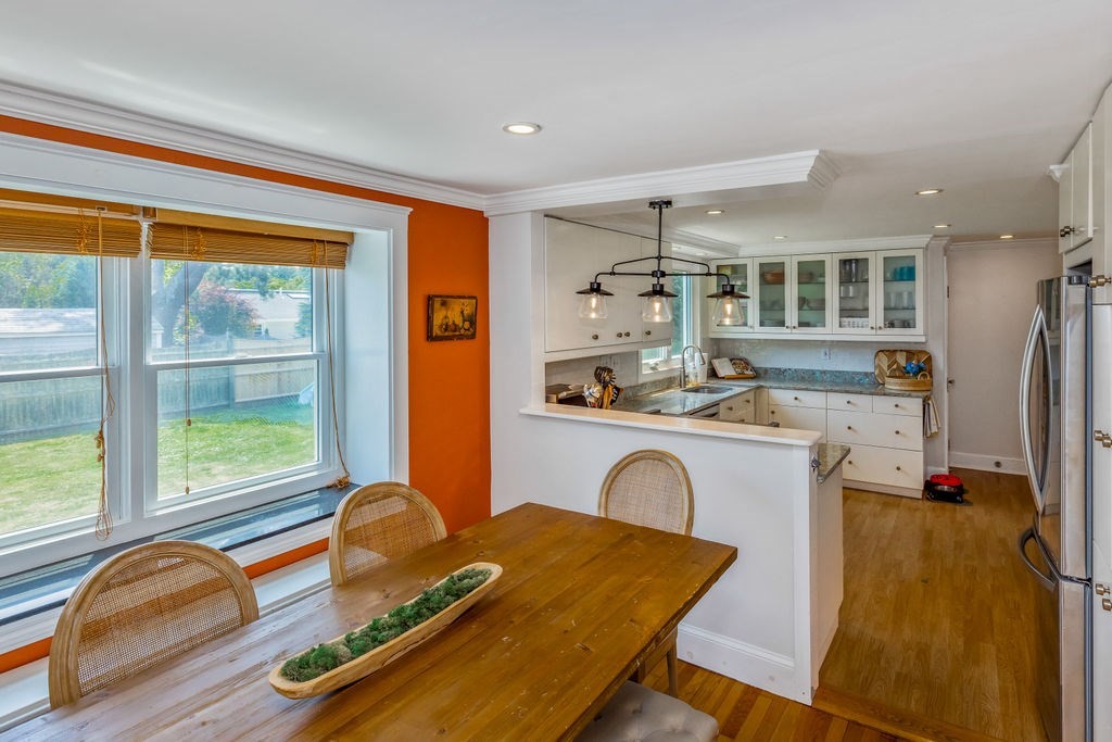 2 Princeton Avenue Beverly, MA 01915 - Photo 5 of 27 a living room with kitchen island granite countertop furniture and a floor to ceiling window