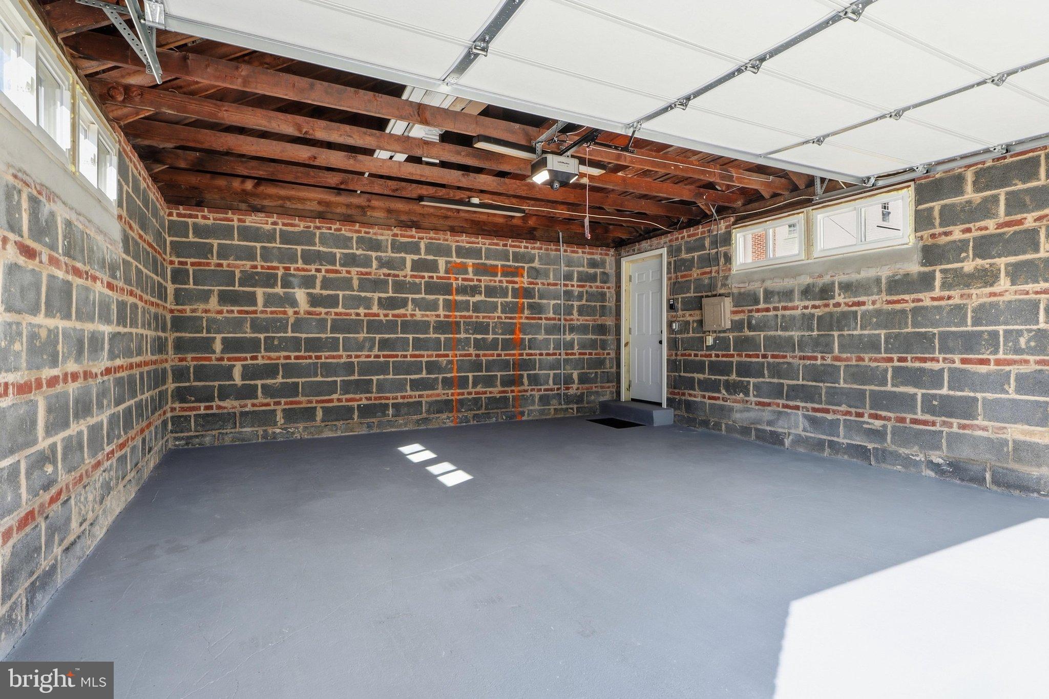 6231 Marlora Road Baltimore, MD 21239 - Photo 19 of 24 Oversized garage, plenty of storage overhead