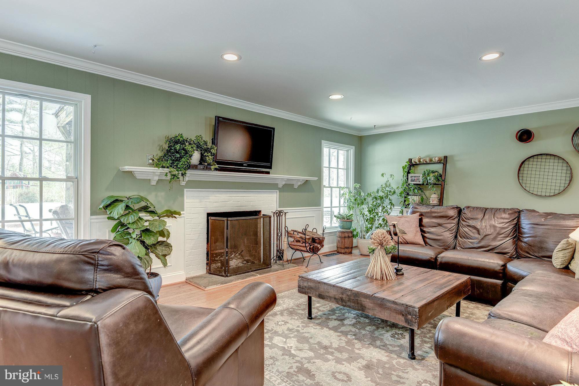 11905 Hunting Ridge Court Potomac, MD 20854 - Photo 9 of 29 Family Room w/ Wood-Burning Fireplace