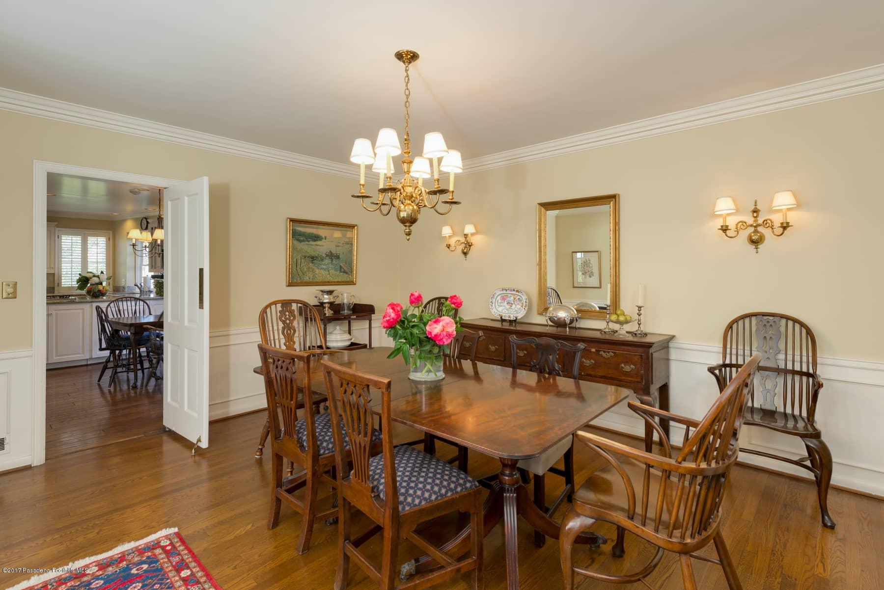 581 Busch Place Pasadena, CA 91105 - Photo 14 of 44 a view of a dining room with furniture wooden floor and chandelier