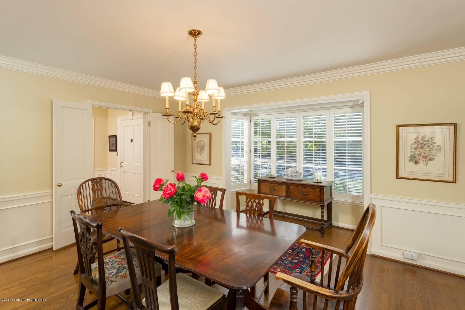 581 Busch Place Pasadena, CA 91105 - Photo 15 of 44 a view of a dining room with furniture a chandelier and wooden floor