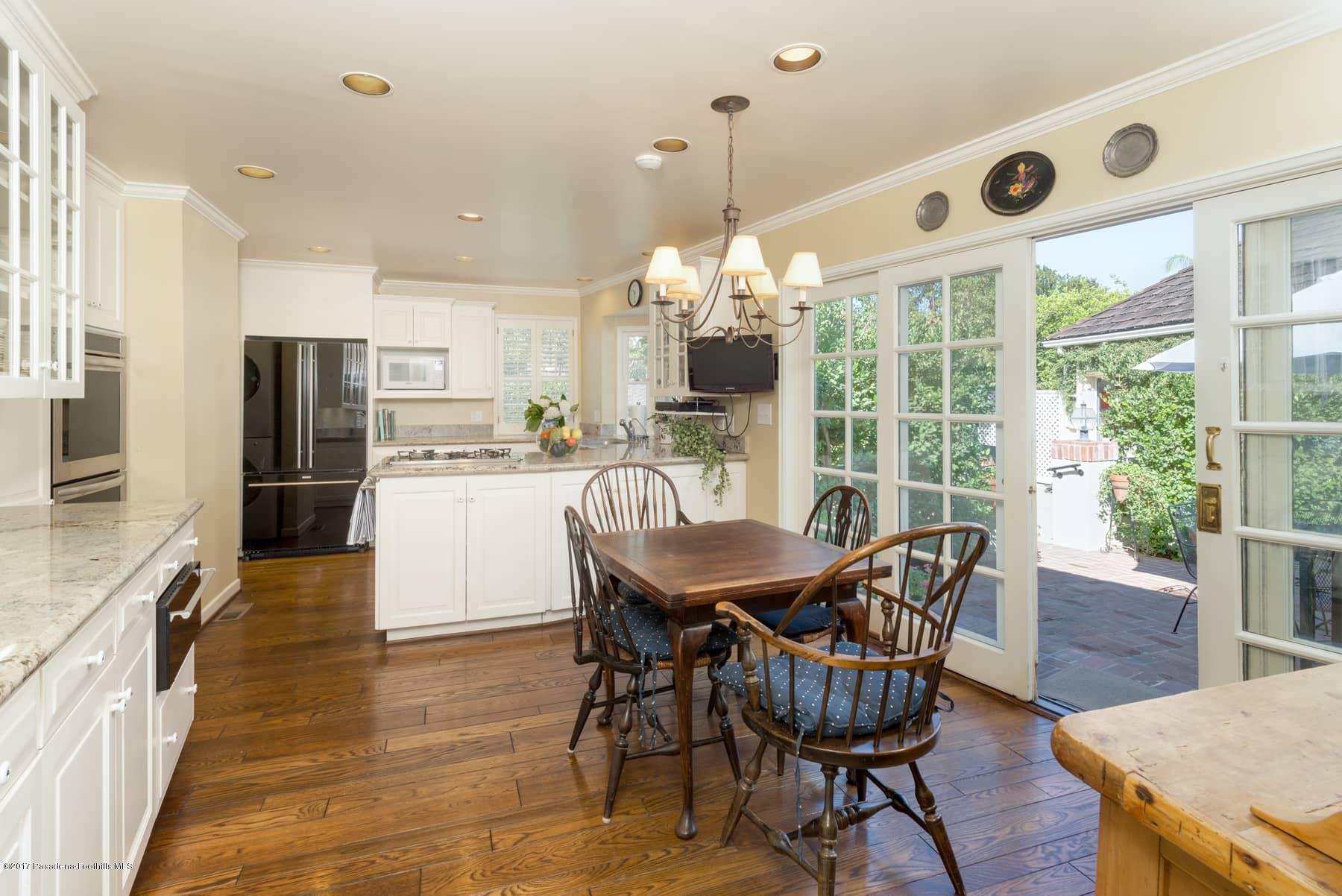 581 Busch Place Pasadena, CA 91105 - Photo 16 of 44 a dining room with furniture a chandelier and wooden floor