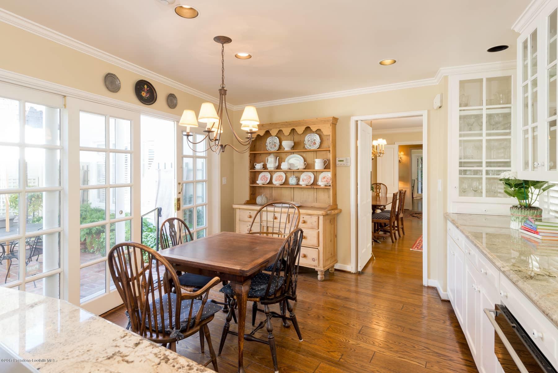 581 Busch Place Pasadena, CA 91105 - Photo 17 of 44 a dining room with furniture a chandelier and wooden floor
