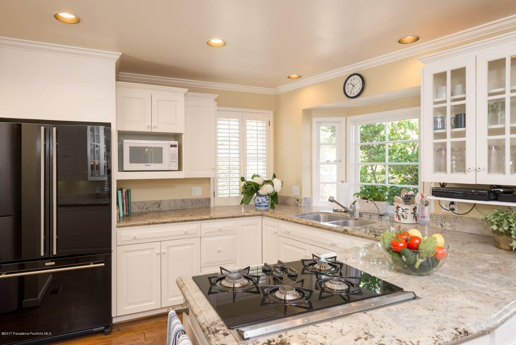 581 Busch Place Pasadena, CA 91105 - Photo 19 of 44 a kitchen with a sink a counter top space and stainless steel appliances