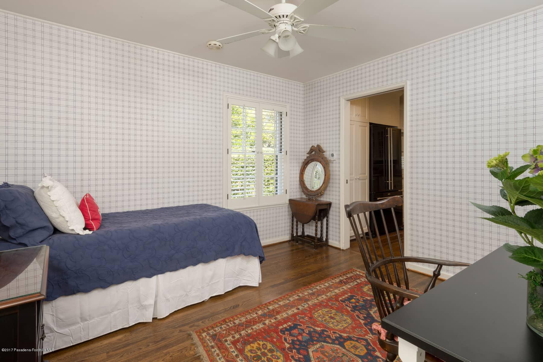 581 Busch Place Pasadena, CA 91105 - Photo 25 of 44 a bedroom with a bed and a chandelier