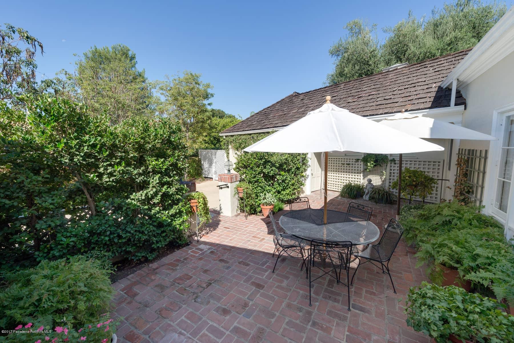 581 Busch Place Pasadena, CA 91105 - Photo 3 of 44 a backyard of a house with a table and chairs