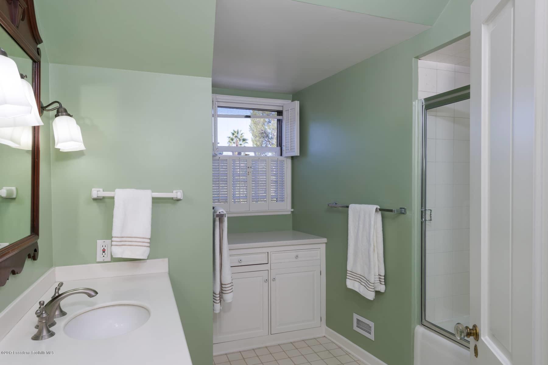 581 Busch Place Pasadena, CA 91105 - Photo 36 of 44 a bathroom with a sink and a mirror