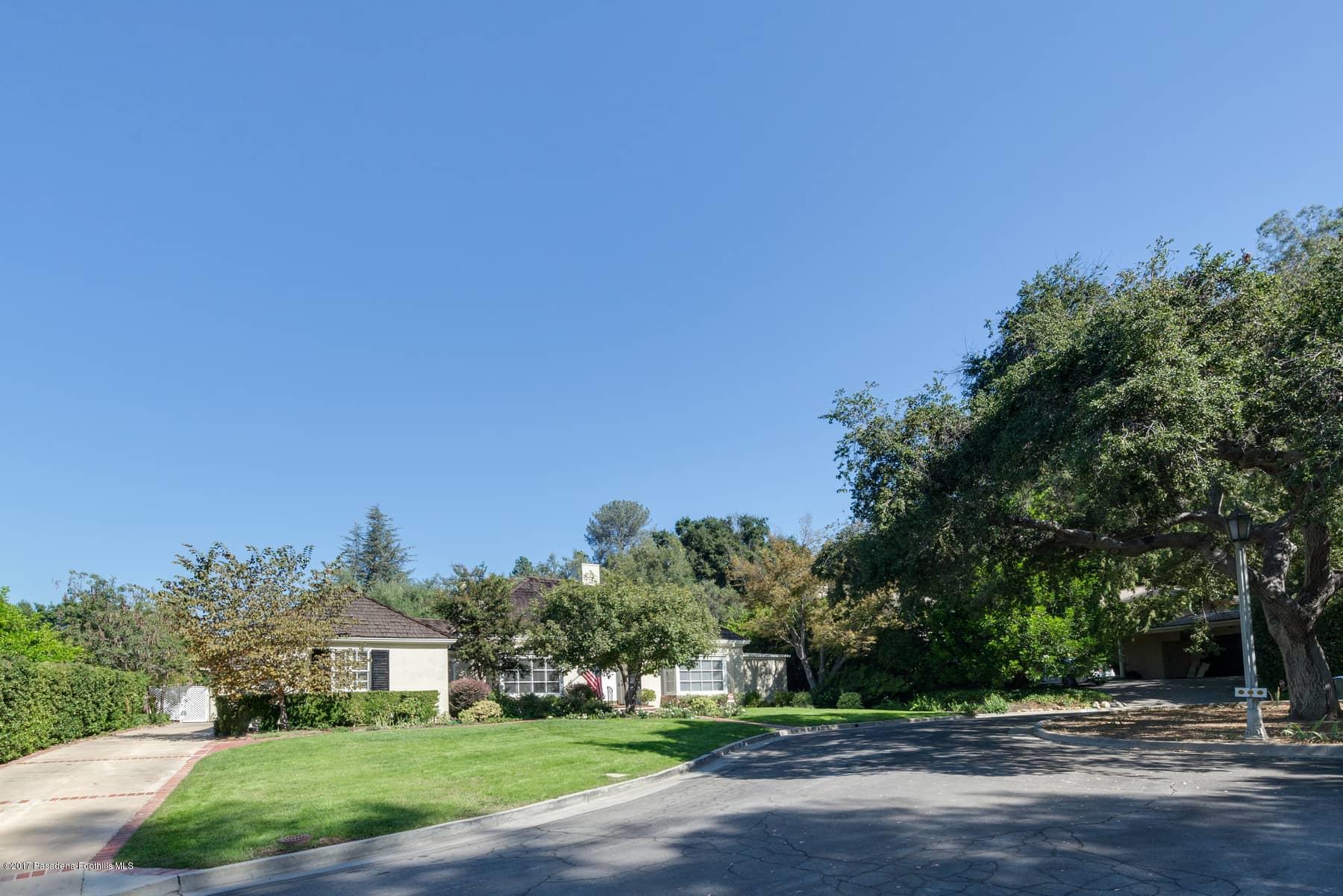 581 Busch Place Pasadena, CA 91105 - Photo 4 of 44 a front view of a house with a yard