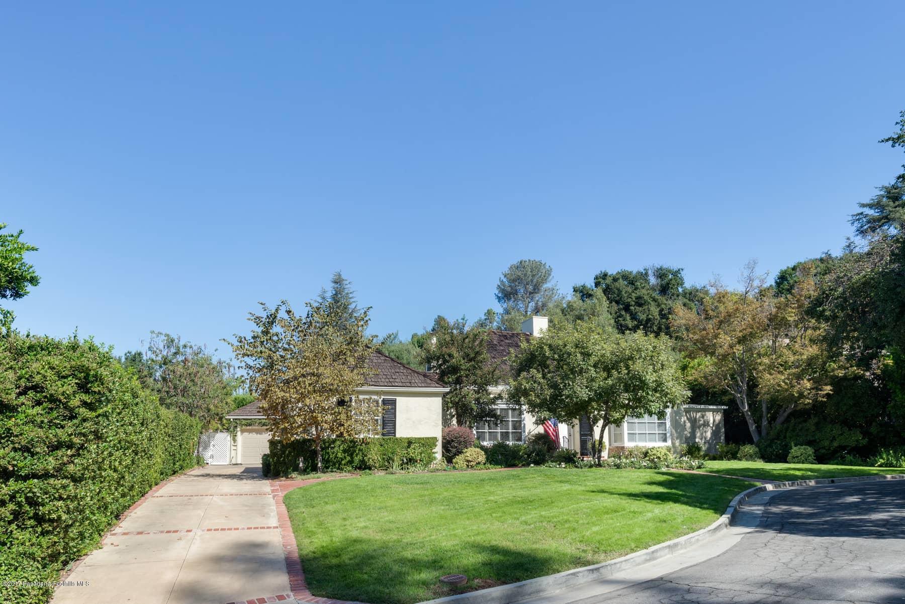 581 Busch Place Pasadena, CA 91105 - Photo 5 of 44 a front view of a house with a yard