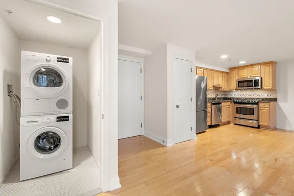 a view of a kitchen with washer and dryer