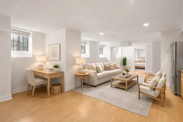 a living room with furniture a table and a window