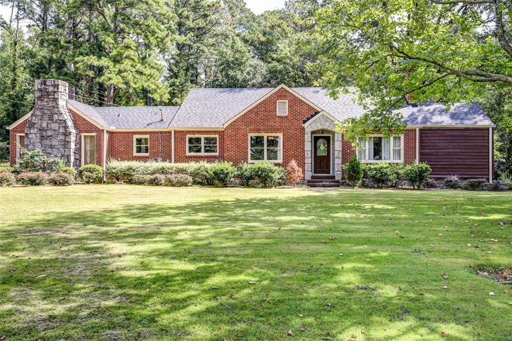 2089 Clairmont Road Decatur, GA 30033 - Photo 1 of 1 a front view of a house with a yard