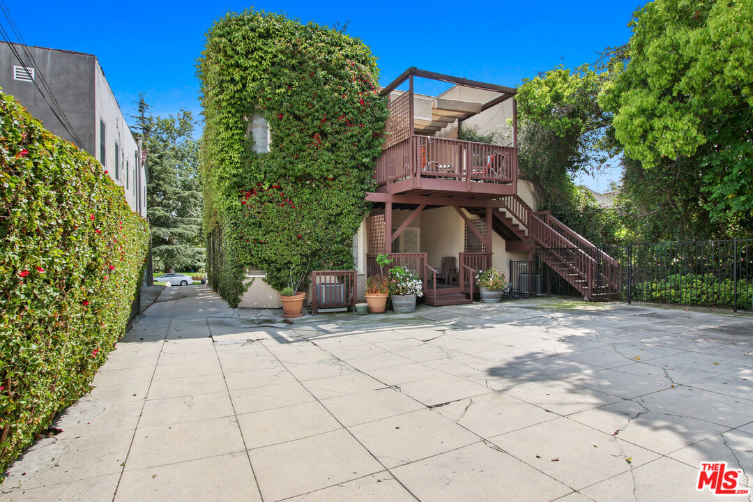 619 North Plymouth Boulevard, Unit 619 Los Angeles, CA 90004 - Photo 13 of 15 a view of a street with potted plants