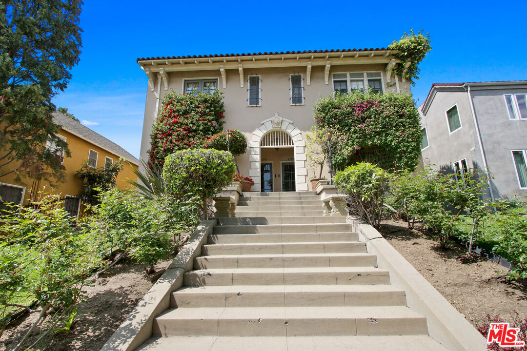 619 North Plymouth Boulevard, Unit 619 Los Angeles, CA 90004 - Photo 2 of 15 a front view of a house with potted plants