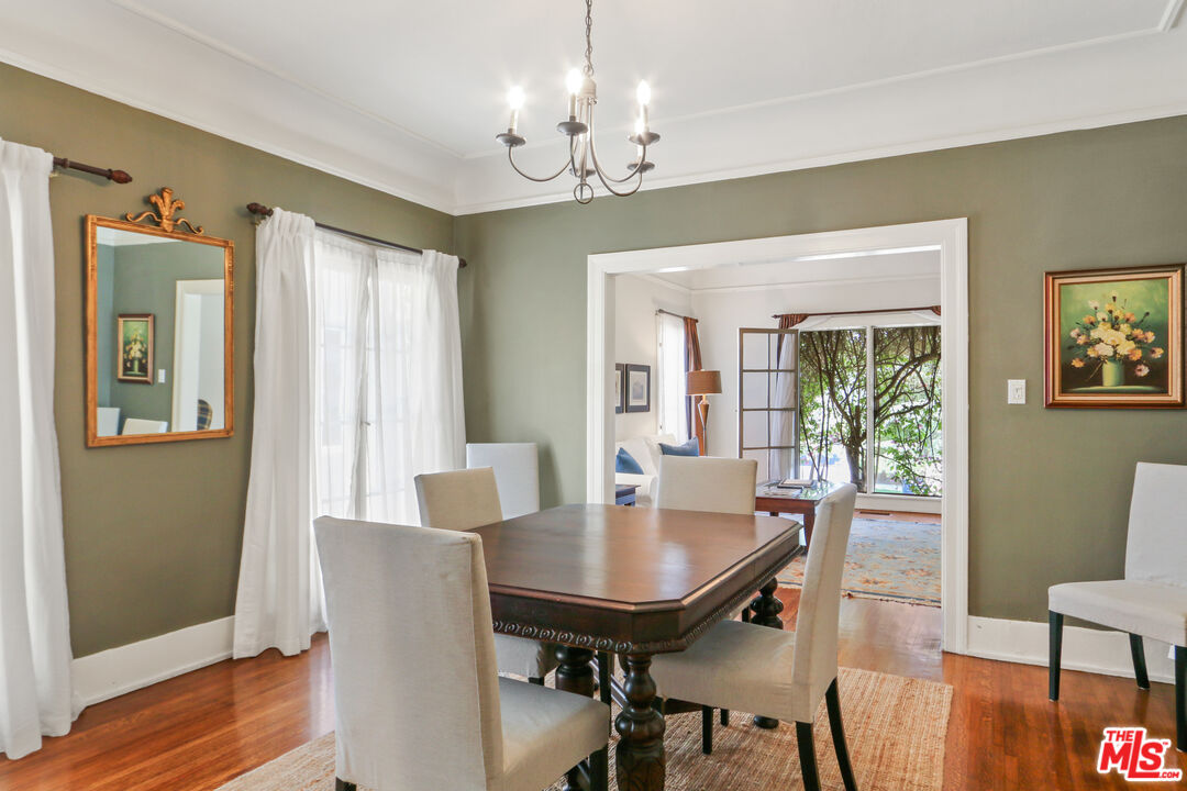 619 North Plymouth Boulevard, Unit 619 Los Angeles, CA 90004 - Photo 6 of 15 a view of a dining room with furniture window and wooden floor