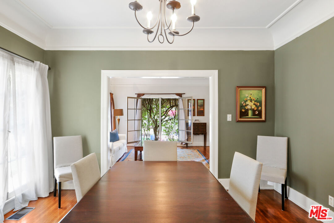 619 North Plymouth Boulevard, Unit 619 Los Angeles, CA 90004 - Photo 7 of 15 a living room with furniture and a fireplace