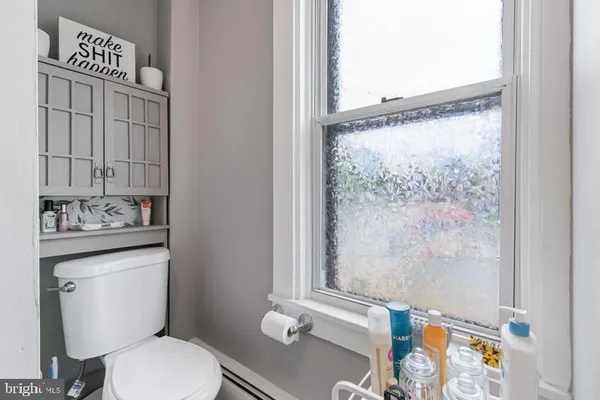 a bathroom with a sink vanity and a mirror