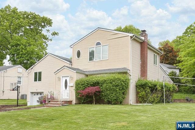 84 12th Street Cresskill, NJ 07626 - Photo 45 of 45 a front view of house with yard and green space