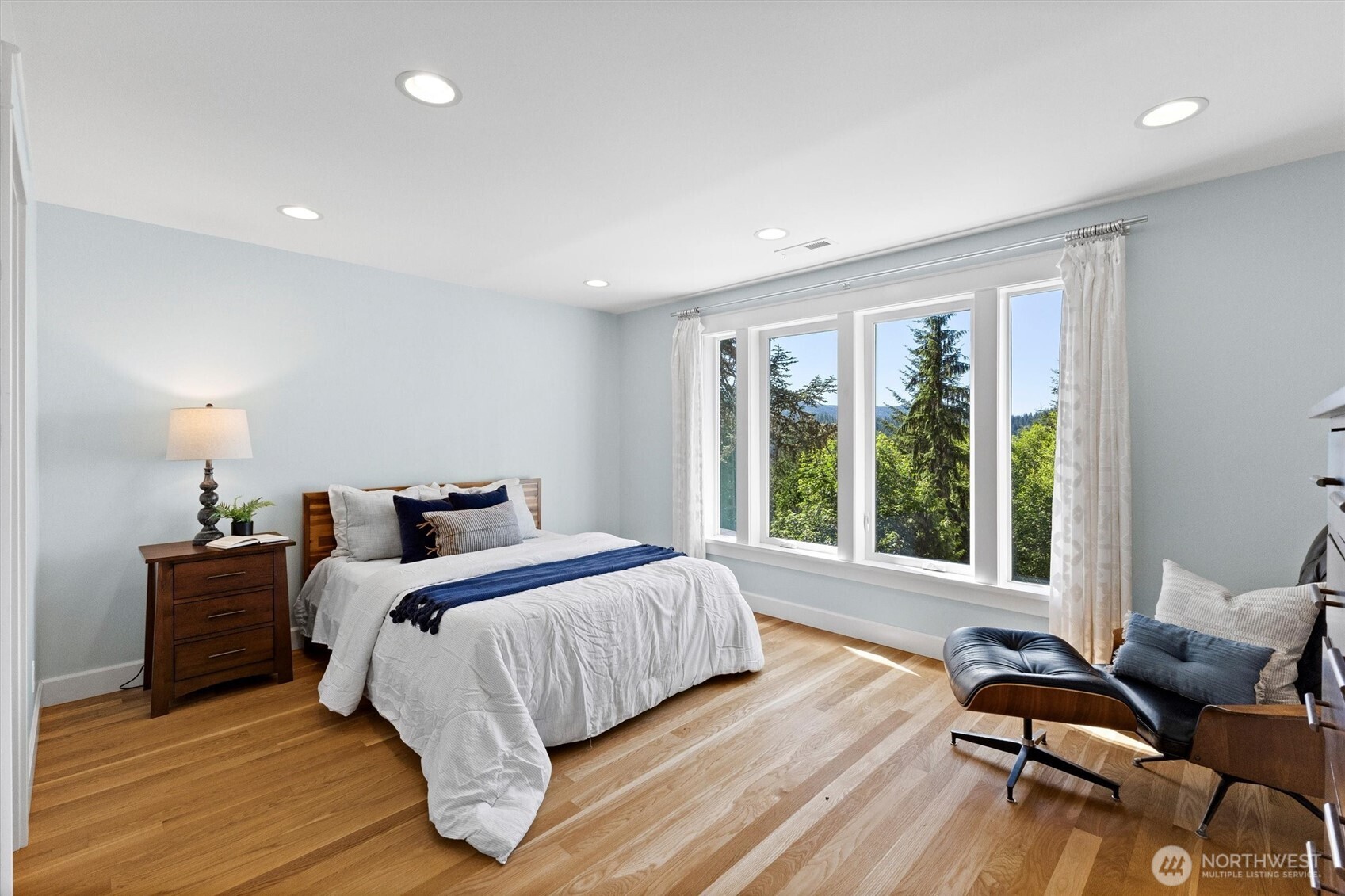 89 Grand View Lane Bellingham, WA 98229 - Photo 18 of 40 a bedroom with a bed and wooden floor