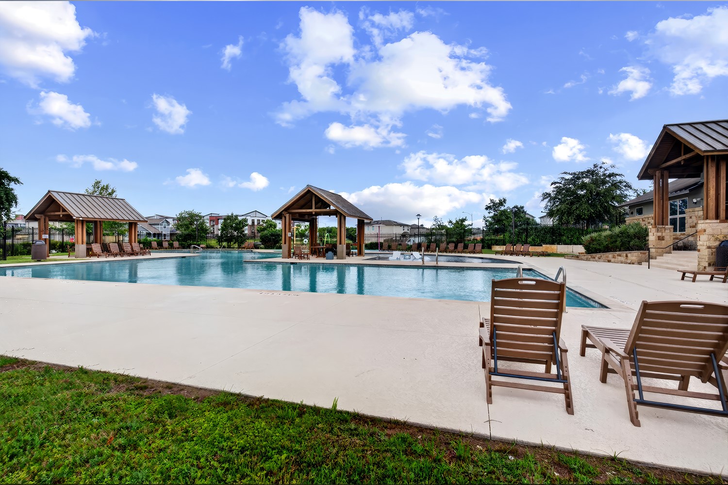 2006 Grow Lane Austin, TX 78754 - Photo 33 of 40 A spacious community pool offers a refreshing oasis with inviting lounging areas.