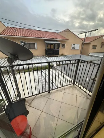 a kitchen with a stove a sink and a microwave