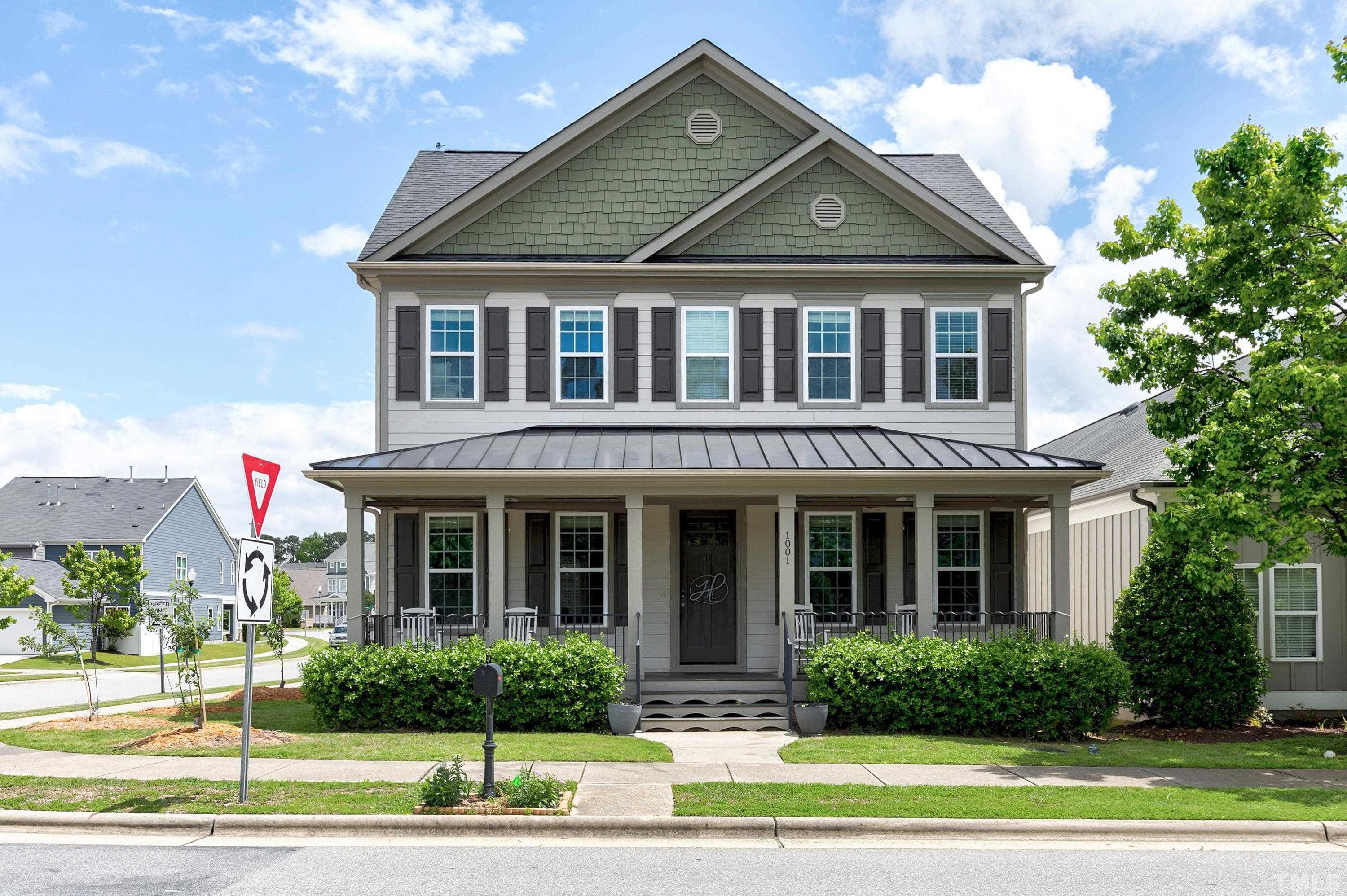 1001 Ambergate Station Apex, NC 27502 - Photo 1 of 49 a front view of a house with a yard