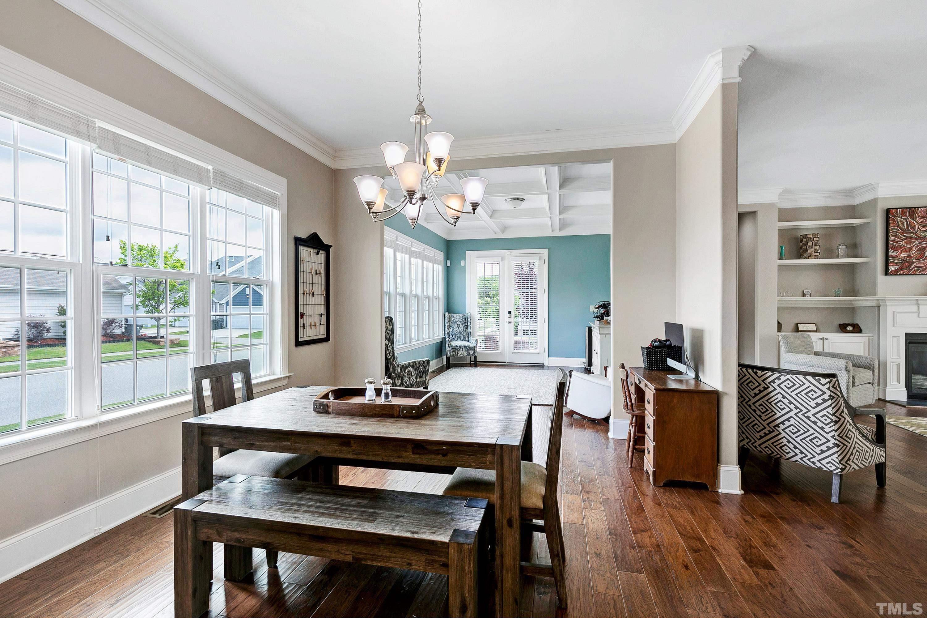 1001 Ambergate Station Apex, NC 27502 - Photo 12 of 49 a view of a dining room with furniture window and wooden floor