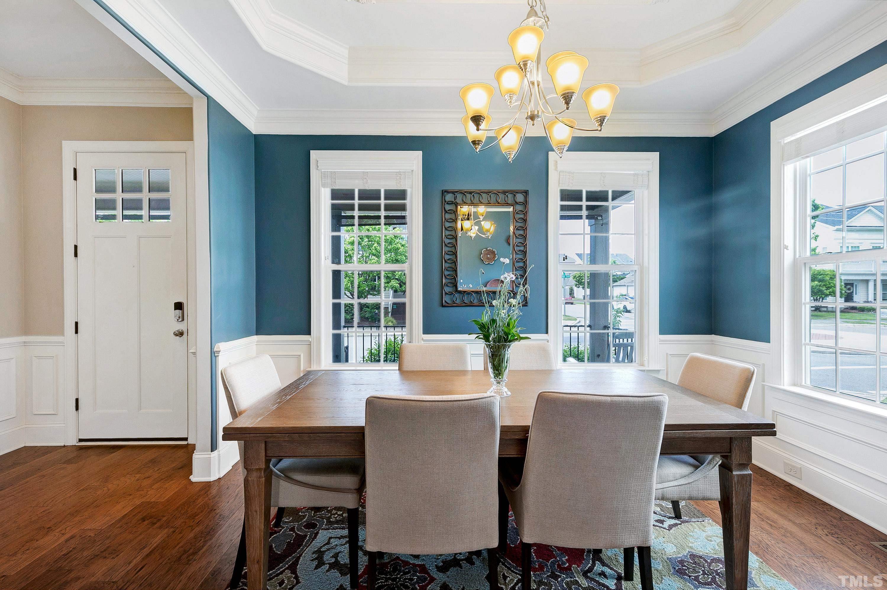 1001 Ambergate Station Apex, NC 27502 - Photo 15 of 49 a view of a dining room with furniture wooden floor and chandelier