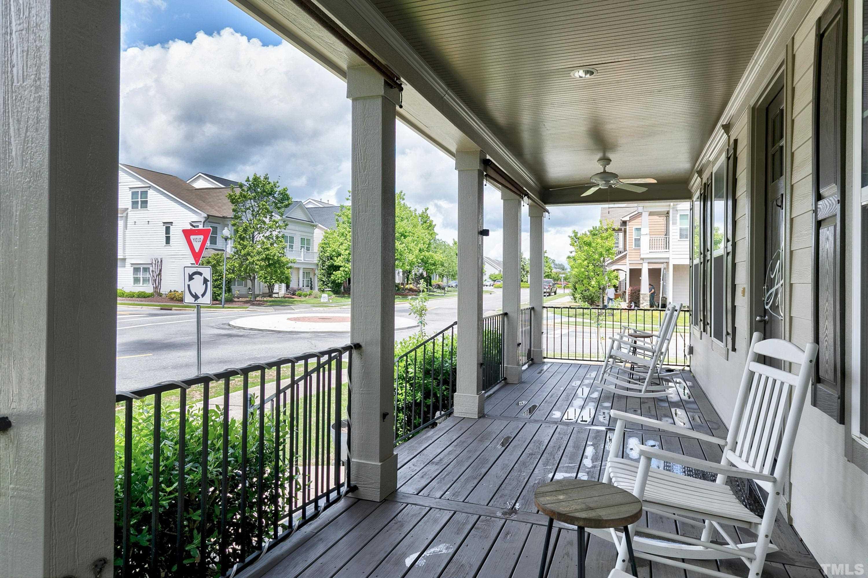 1001 Ambergate Station Apex, NC 27502 - Photo 2 of 49 a view of a patio with a table chairs and garden