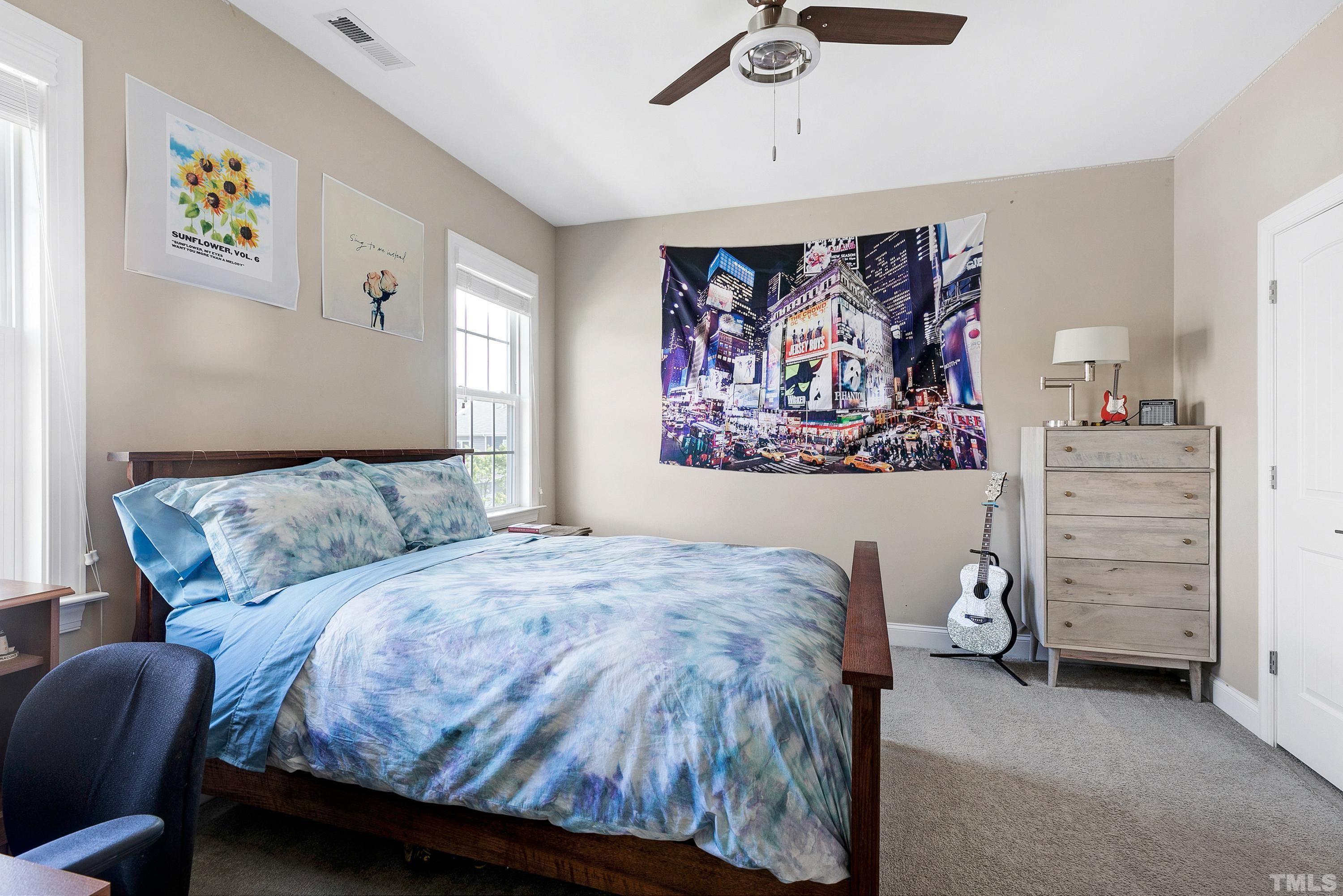 1001 Ambergate Station Apex, NC 27502 - Photo 28 of 49 a bedroom with a bed and a cabinet