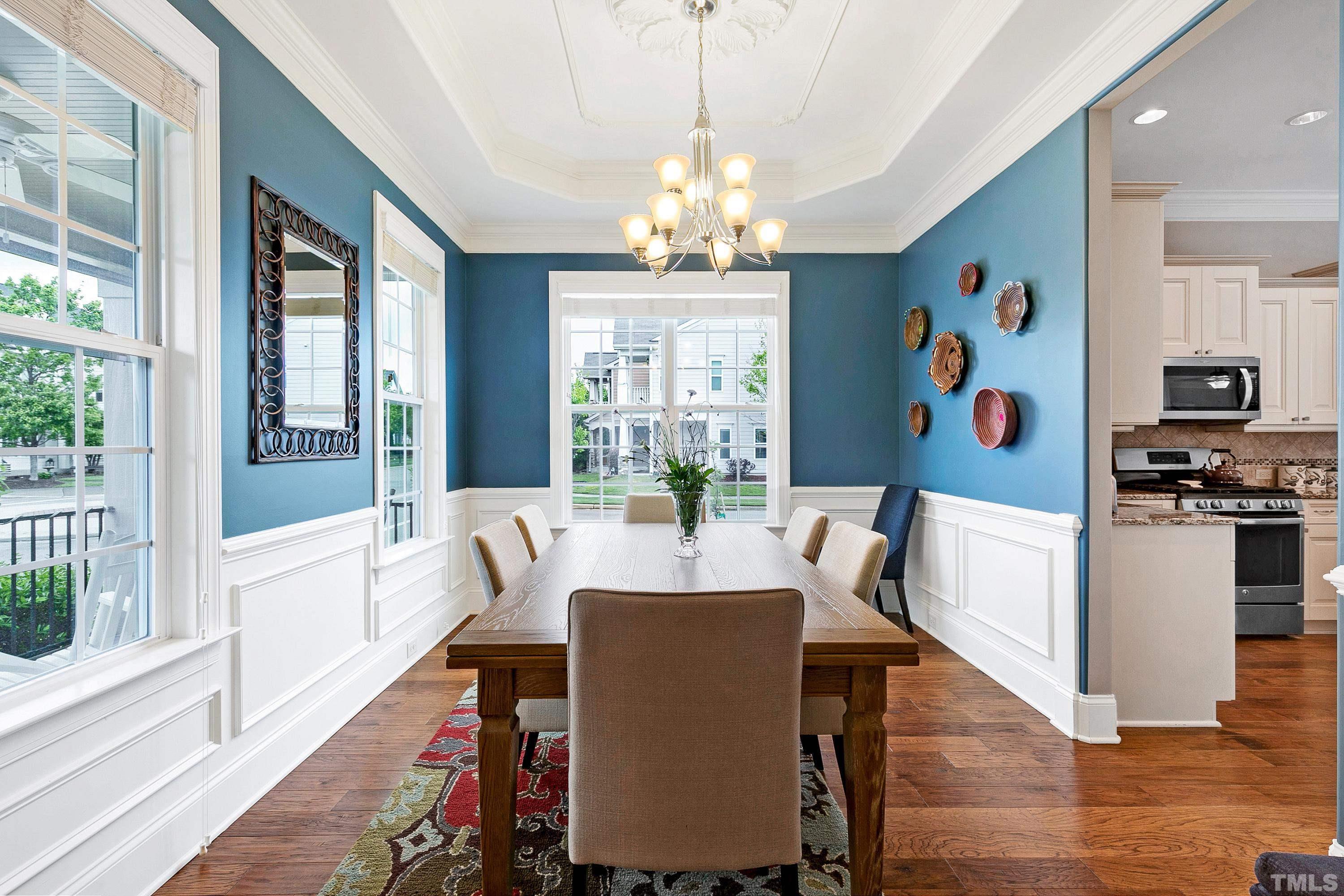 1001 Ambergate Station Apex, NC 27502 - Photo 3 of 49 a view of a dining room with furniture large window and wooden floor