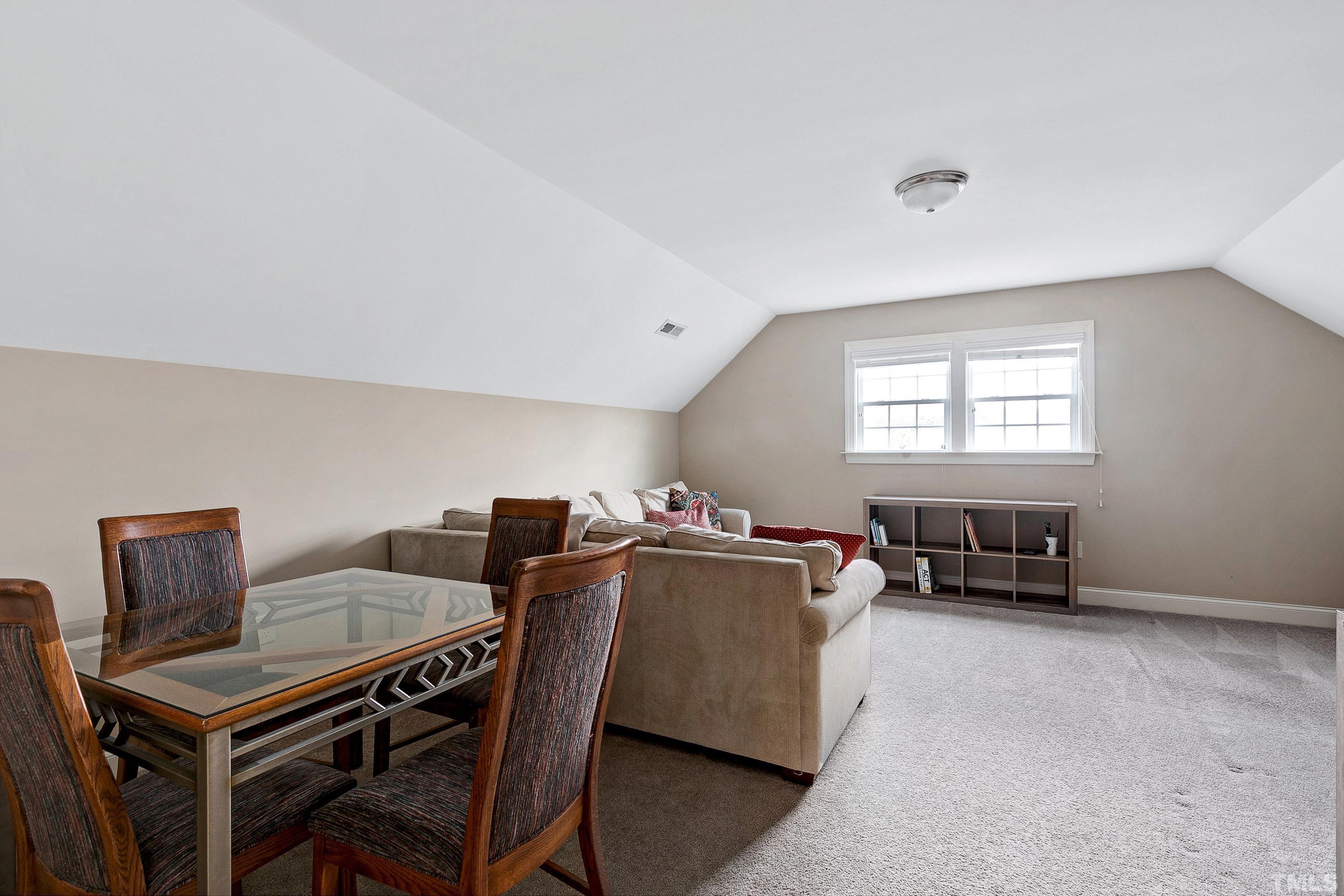 1001 Ambergate Station Apex, NC 27502 - Photo 32 of 49 a living room with furniture a window and a table