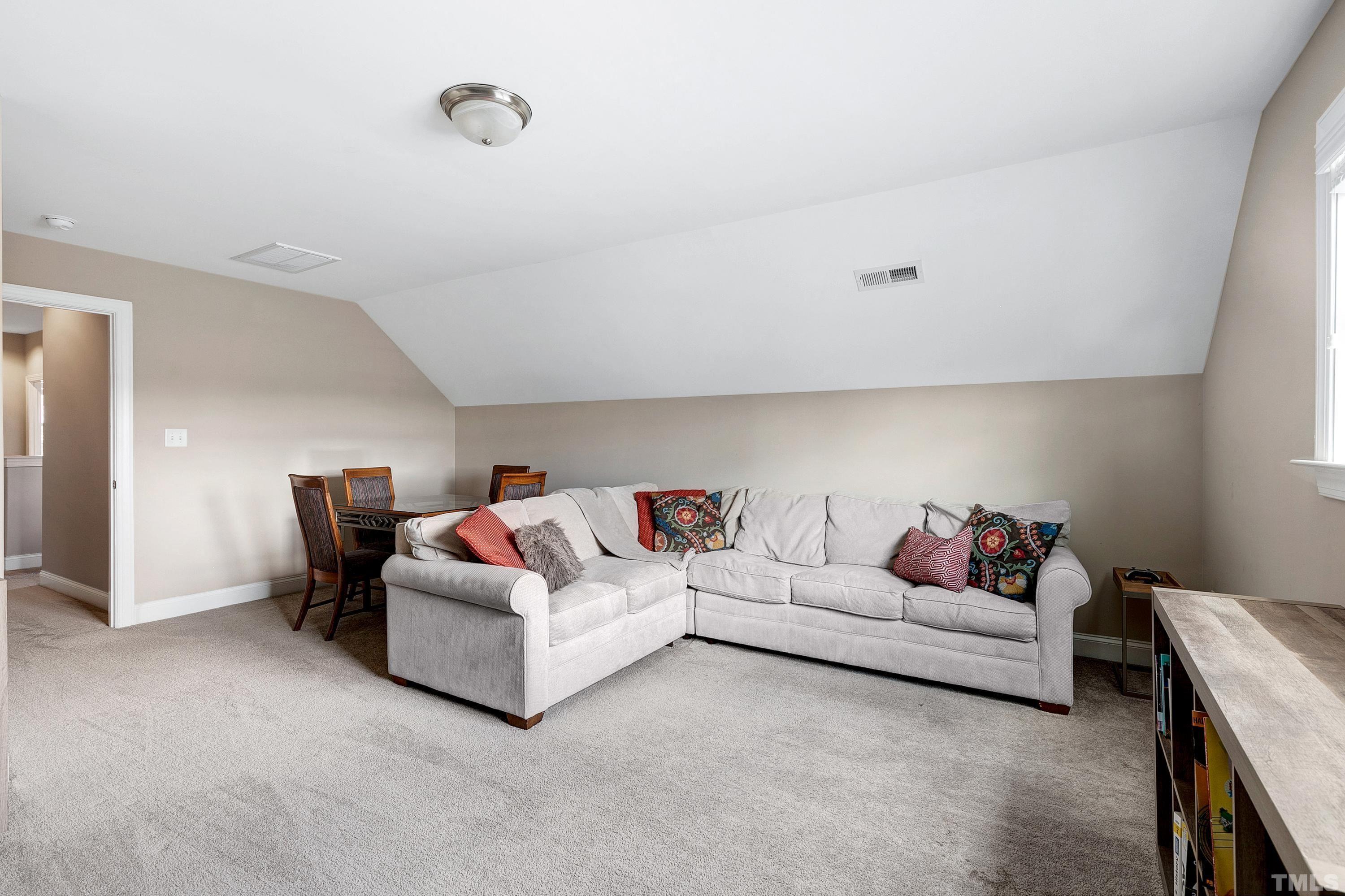 1001 Ambergate Station Apex, NC 27502 - Photo 34 of 49 a living room with furniture and a couch