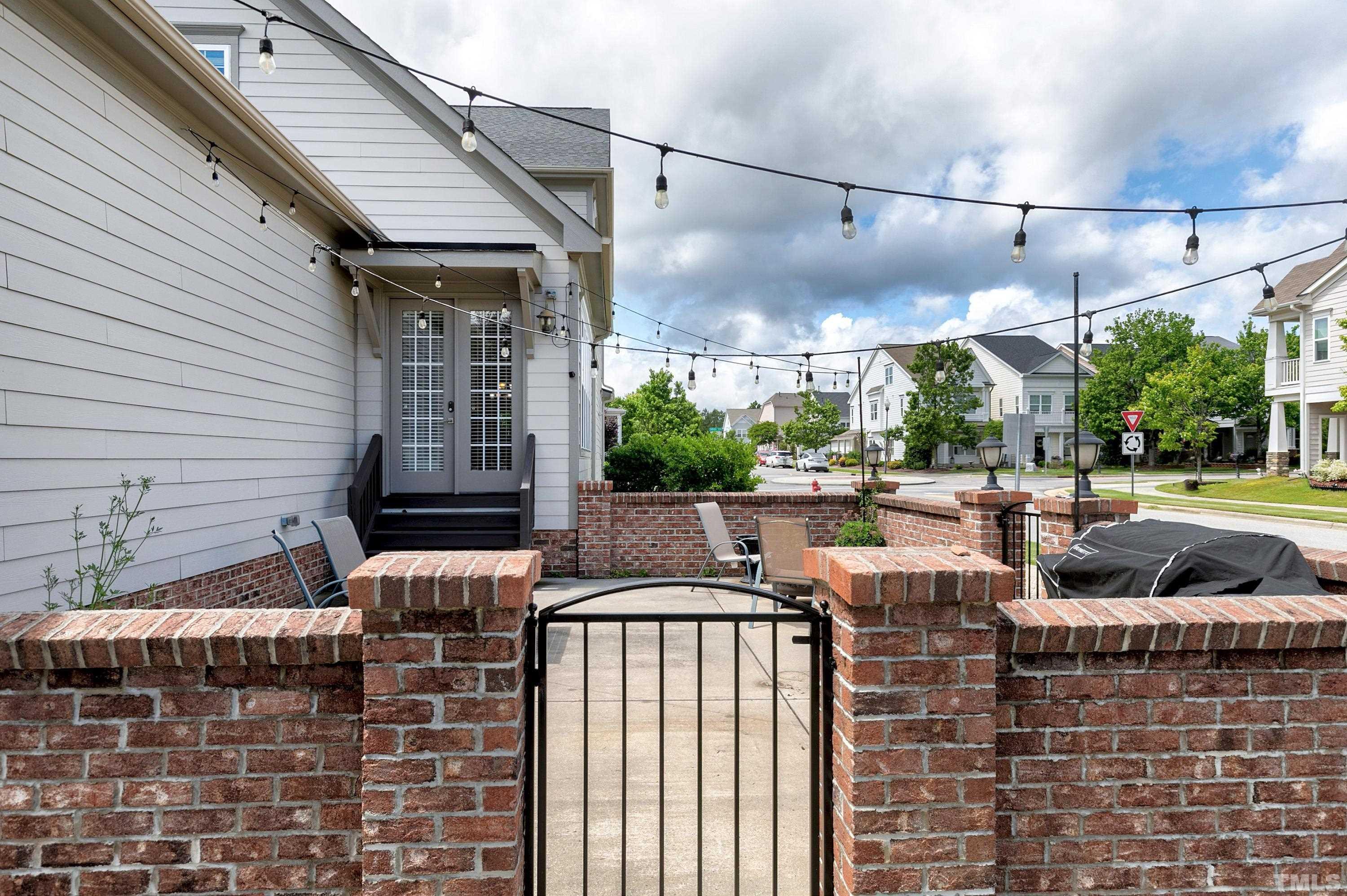 1001 Ambergate Station Apex, NC 27502 - Photo 39 of 49 a view of a patio with couches chairs and a fire pit