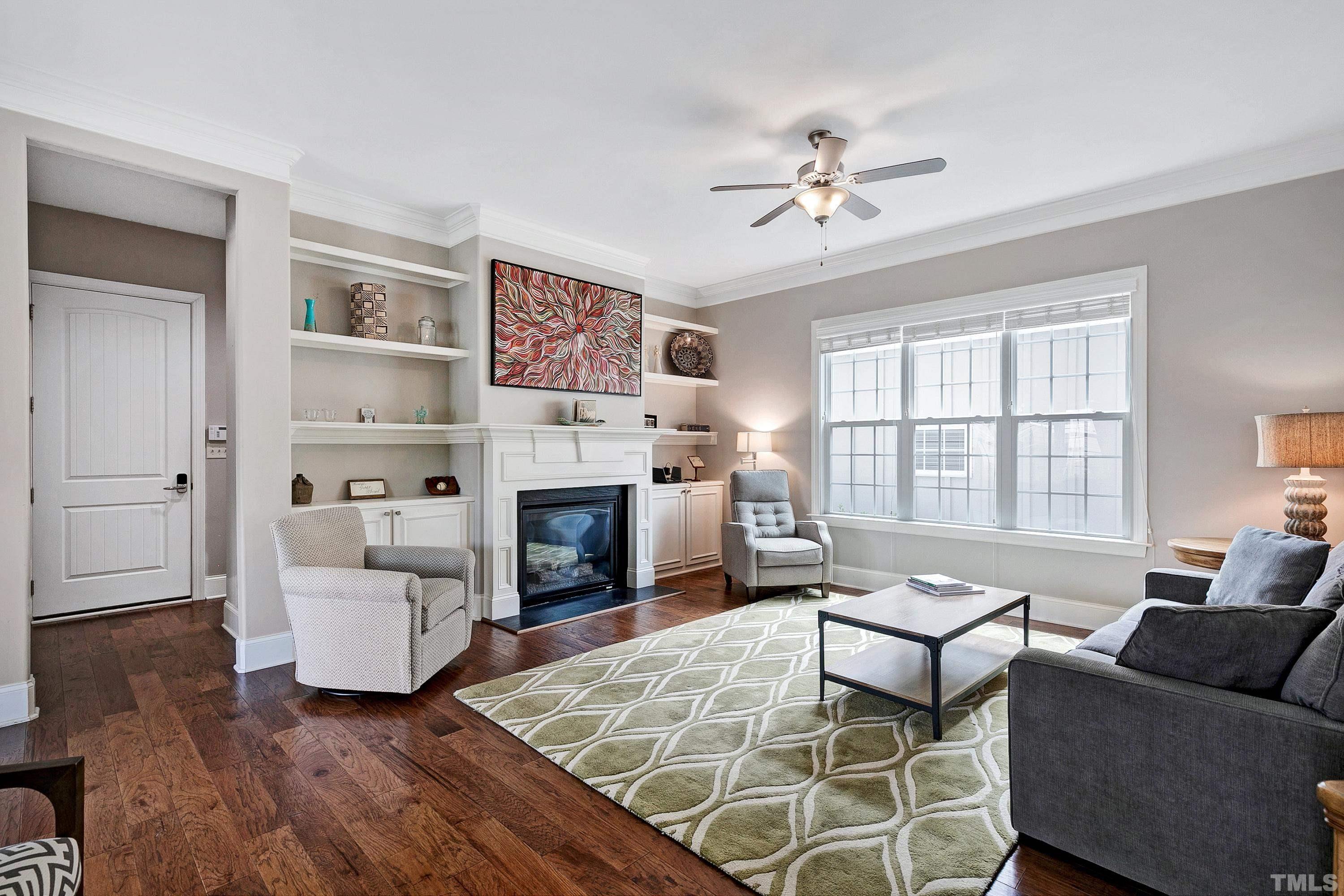 1001 Ambergate Station Apex, NC 27502 - Photo 4 of 49 a living room with furniture and a fireplace