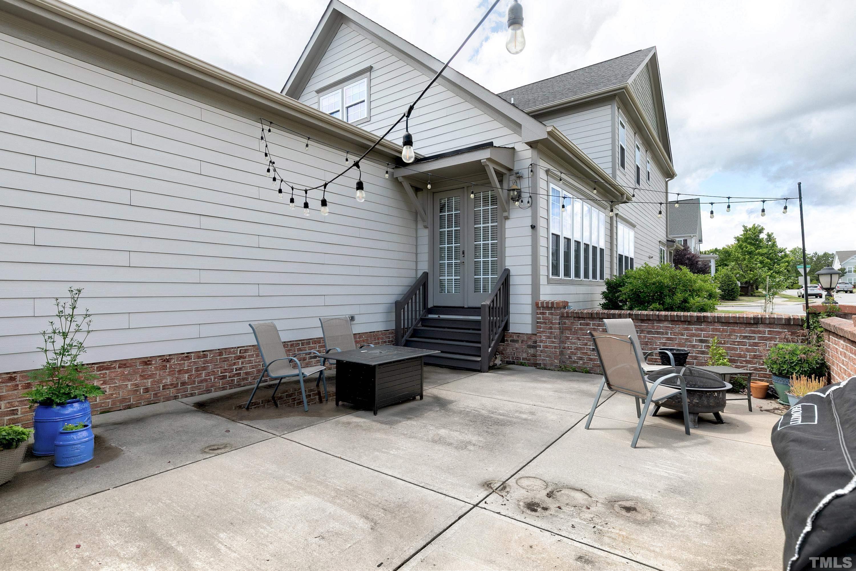 1001 Ambergate Station Apex, NC 27502 - Photo 41 of 49 a view of a patio with couple of chairs and potted plants