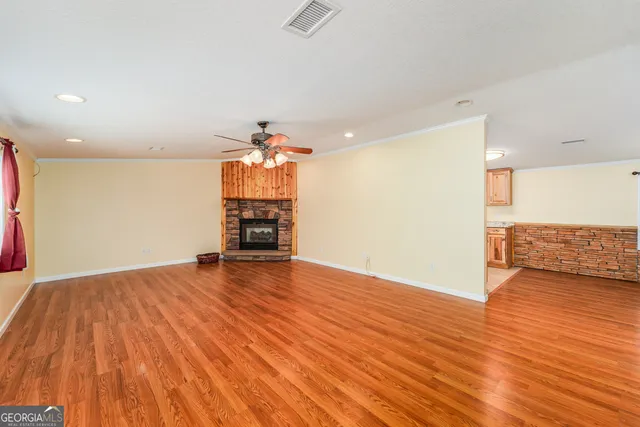 a view of a livingroom with wooden floor