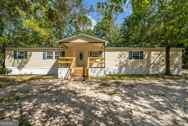 a house with trees in the background
