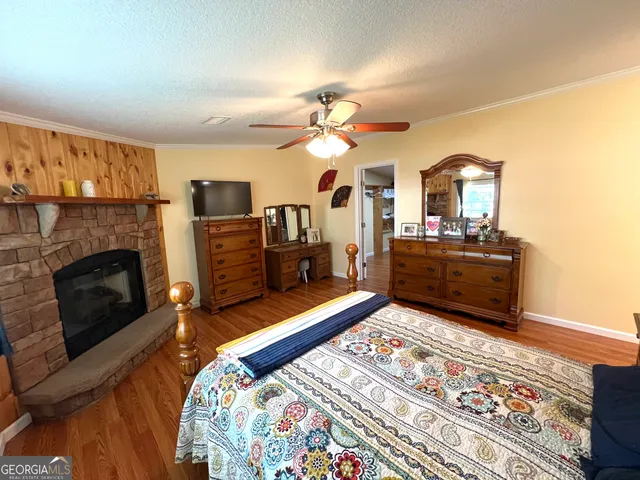 a bedroom with furniture and a fireplace