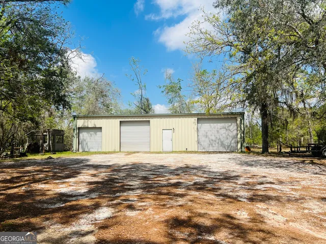 a big house with a big yard and large trees