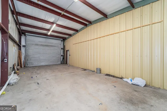 a view of a chair and table in backyard