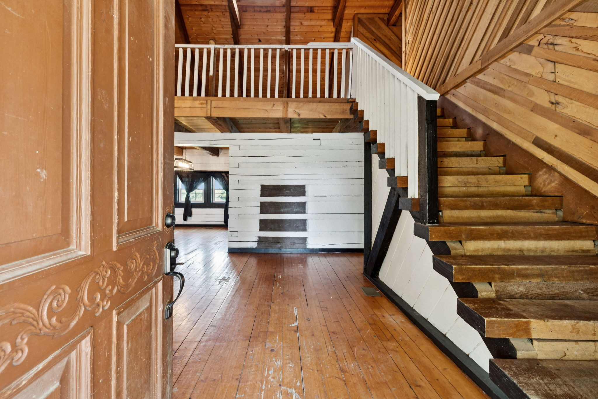 294 Ed Harris Road Ashland City, TN 37015 - Photo 19 of 65 a view of a staircase with wooden floor and a rug