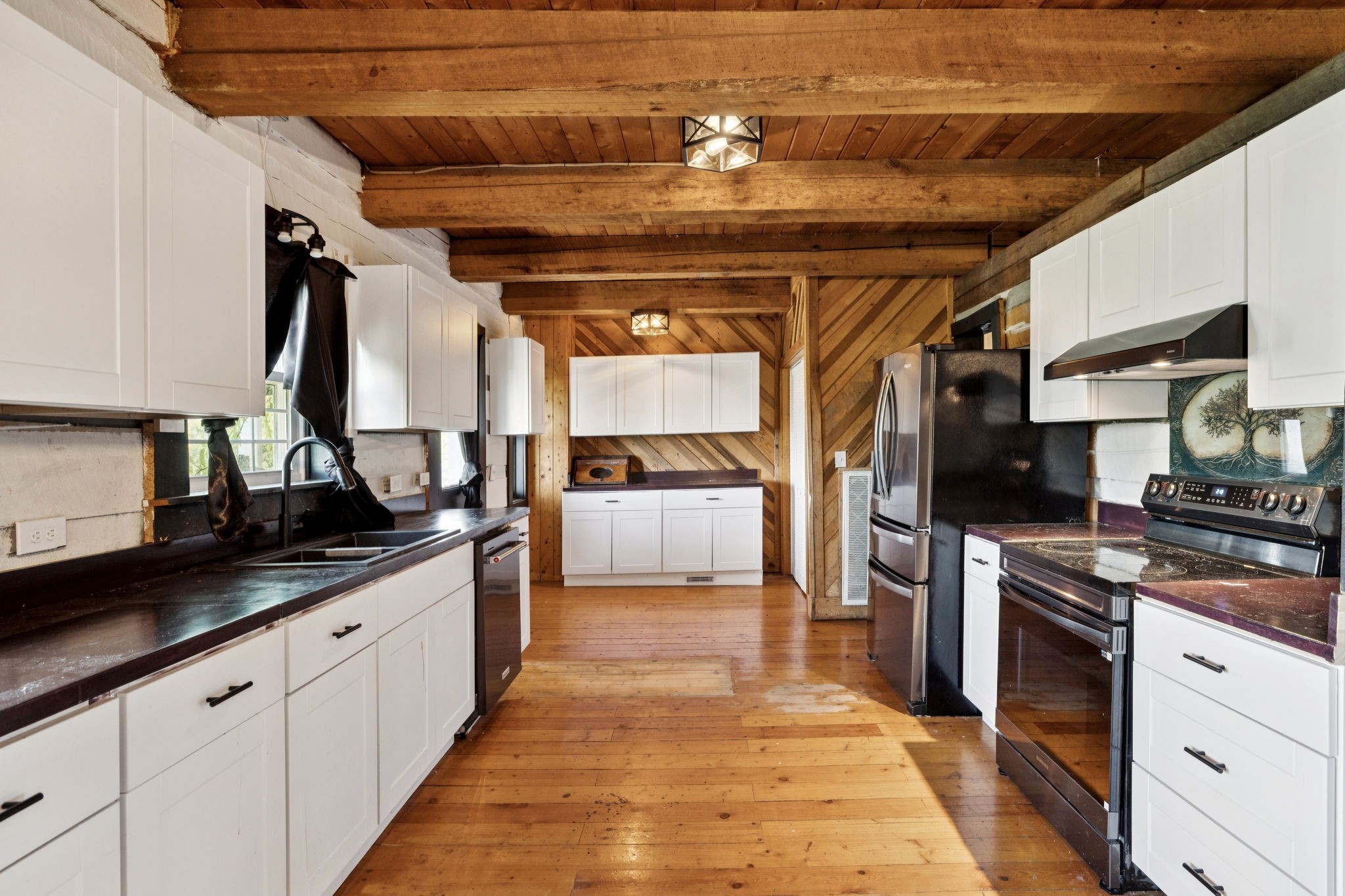 294 Ed Harris Road Ashland City, TN 37015 - Photo 28 of 65 a kitchen with stainless steel appliances granite countertop a sink and cabinets