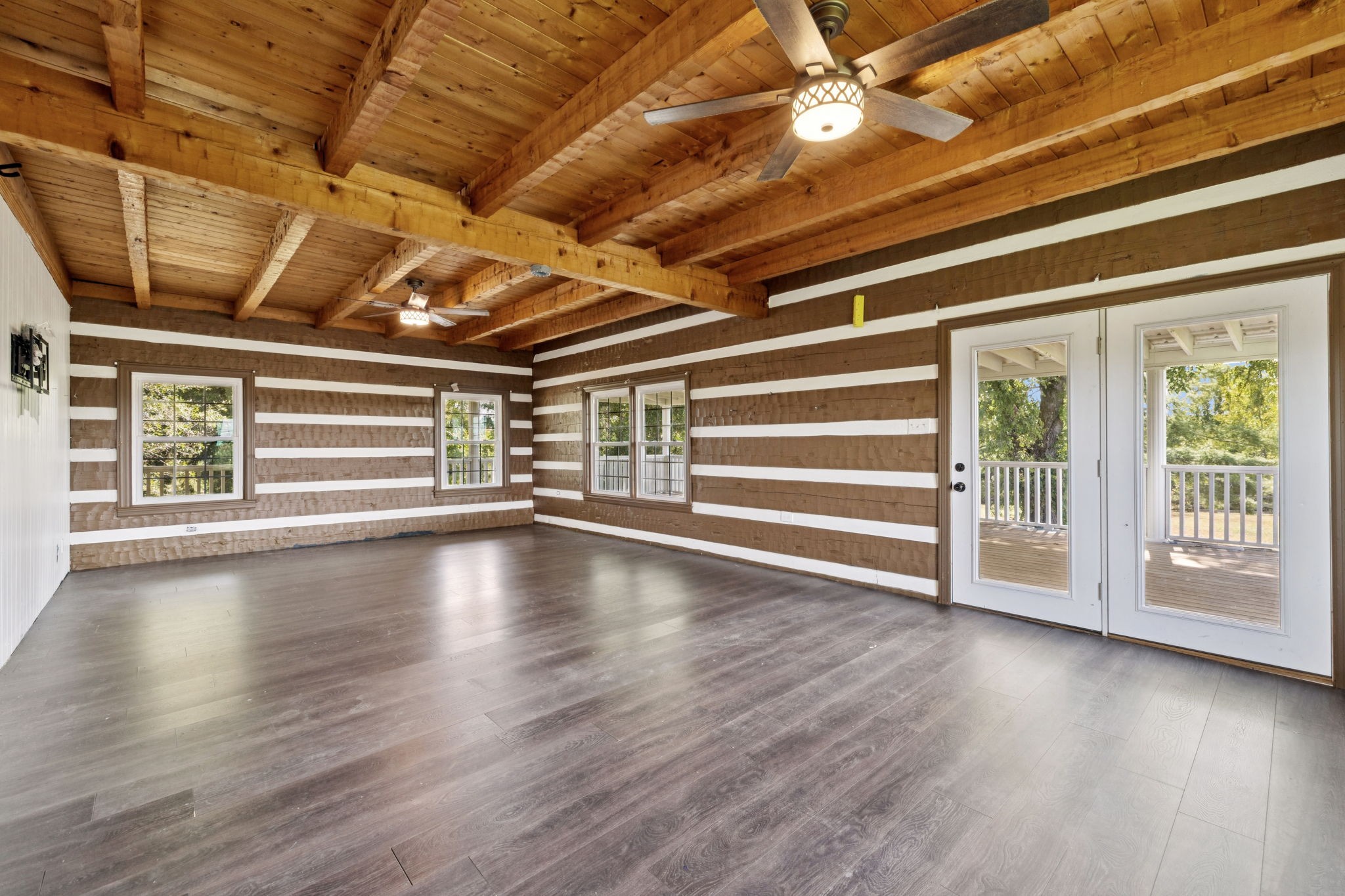 294 Ed Harris Road Ashland City, TN 37015 - Photo 31 of 65 a view of empty room with wooden floor and fireplace