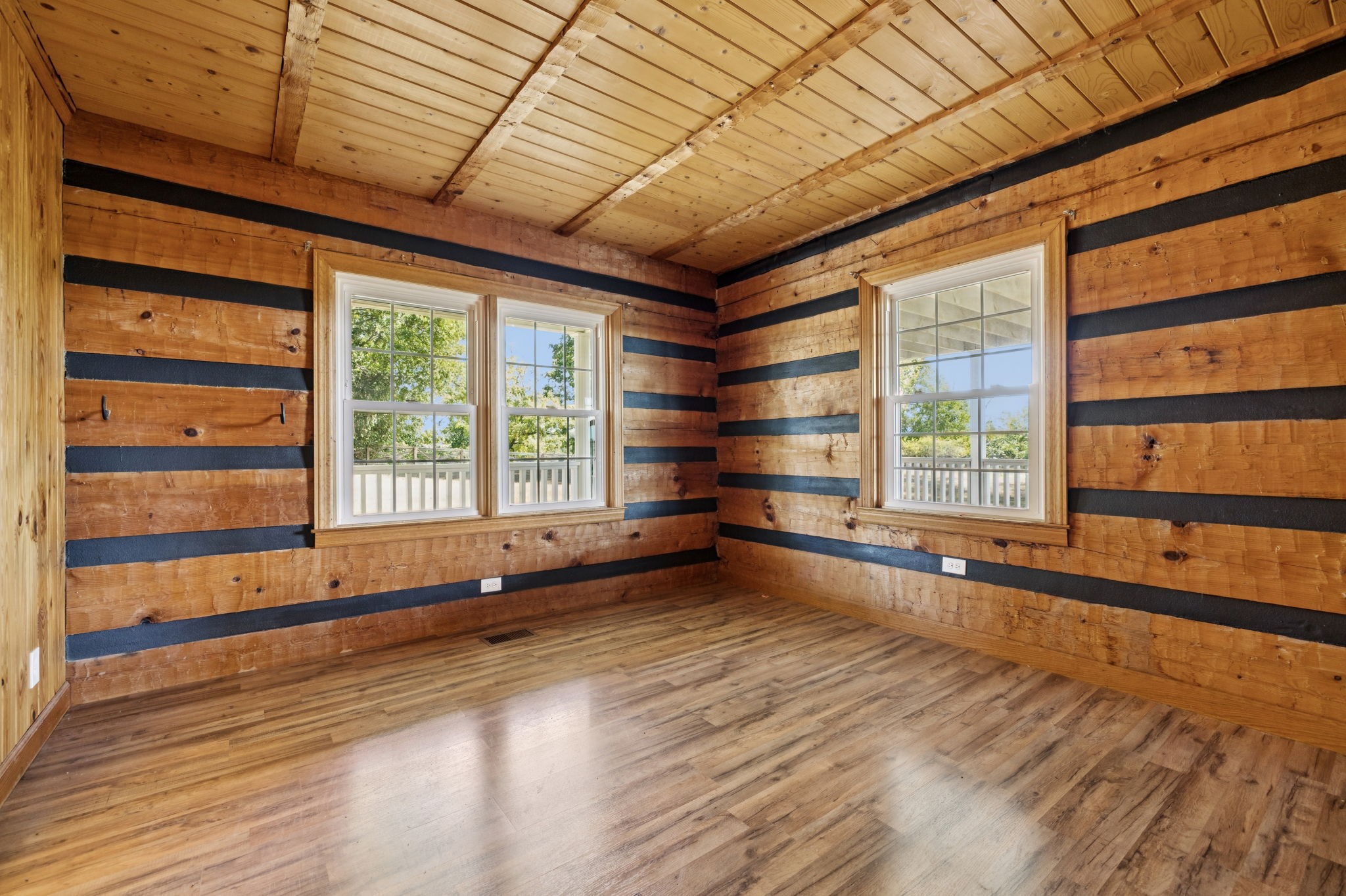 294 Ed Harris Road Ashland City, TN 37015 - Photo 39 of 65 a view of an empty room with a window and wooden floor