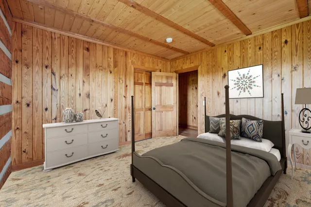 a view of a room with wooden walls