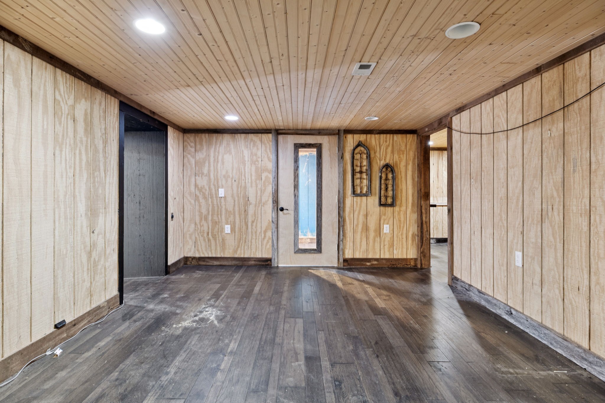 294 Ed Harris Road Ashland City, TN 37015 - Photo 56 of 65 a view of an empty room with wooden floor and a window
