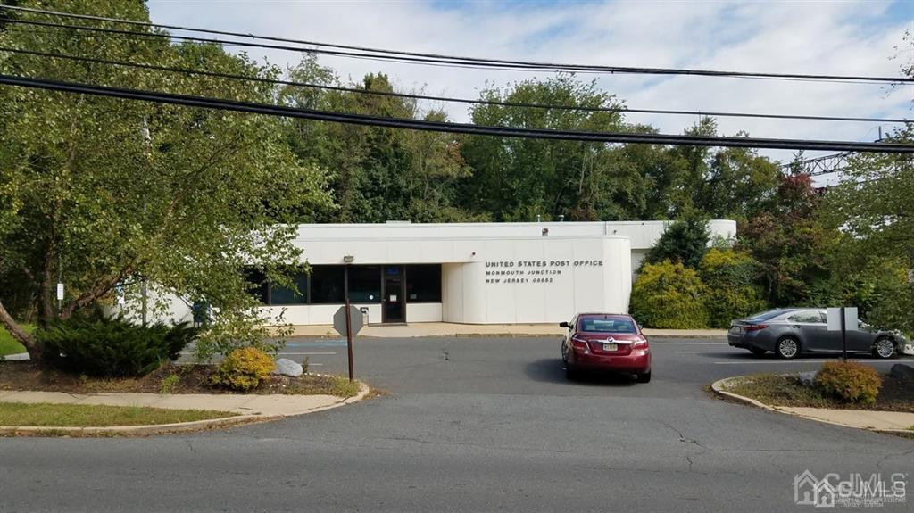 648 Ridge Road Monmouth Junction, NJ 08852 - Photo 2 of 2 a view of a city street with a car parked on the road