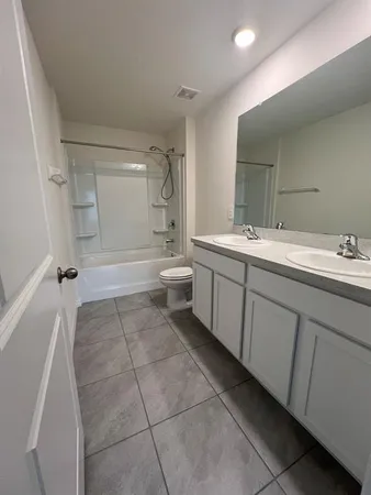 a bathroom with a sink a toilet and a bathtub